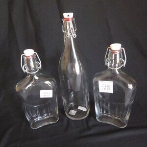 NEW 12.5” - 9.5” CRATE BARREL ITALY CLEAR GLASS AIR TIGHT LOCKING TOP 3 BOTTLES